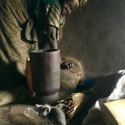 A friend in Amuru, Northern Uganda teaches me to grind sesame butter. Her village has several grinding machines, but she prefers to use her grandmother’s stone ' January 2021