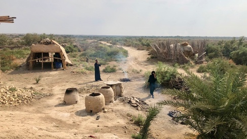 An Ahwari family cook Saih bread