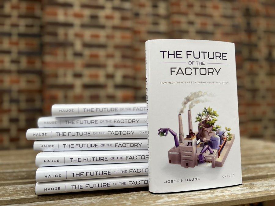 Stack of books and a view of the front cover of Jostein Hague's book The Future of the Factory: How Megatrends are Changing Industrialization